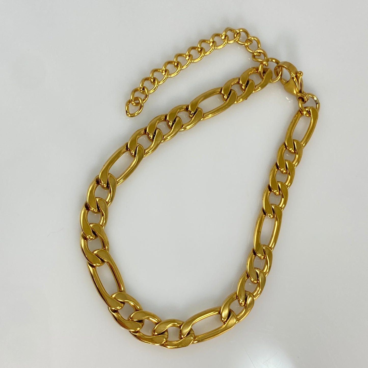 Bracelet à maillons Figaro en or de 7 mm de large et 1/4" en acier inoxydable 316L