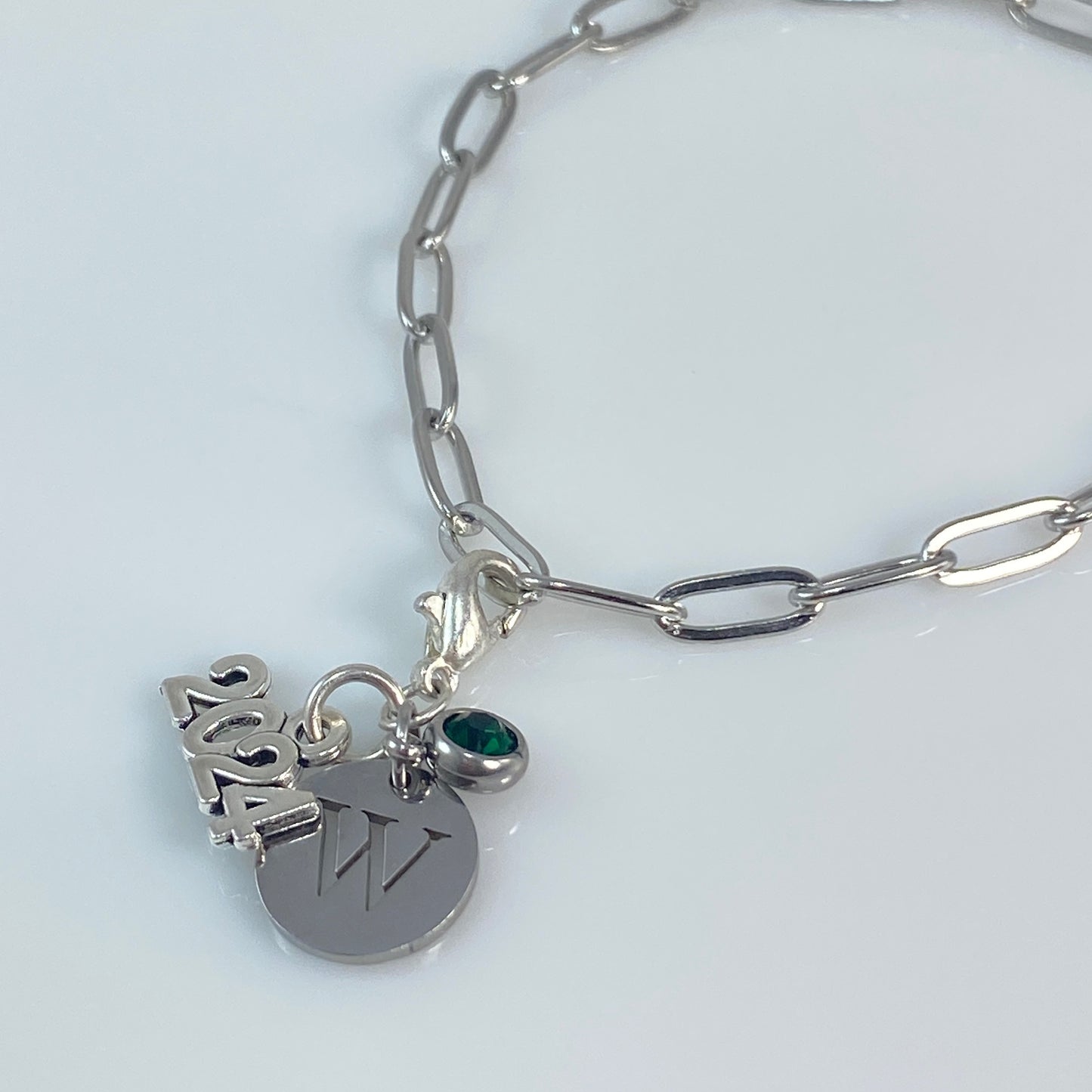 Charm dangle will be with a round bail, not a lobster clasp for the necklace version