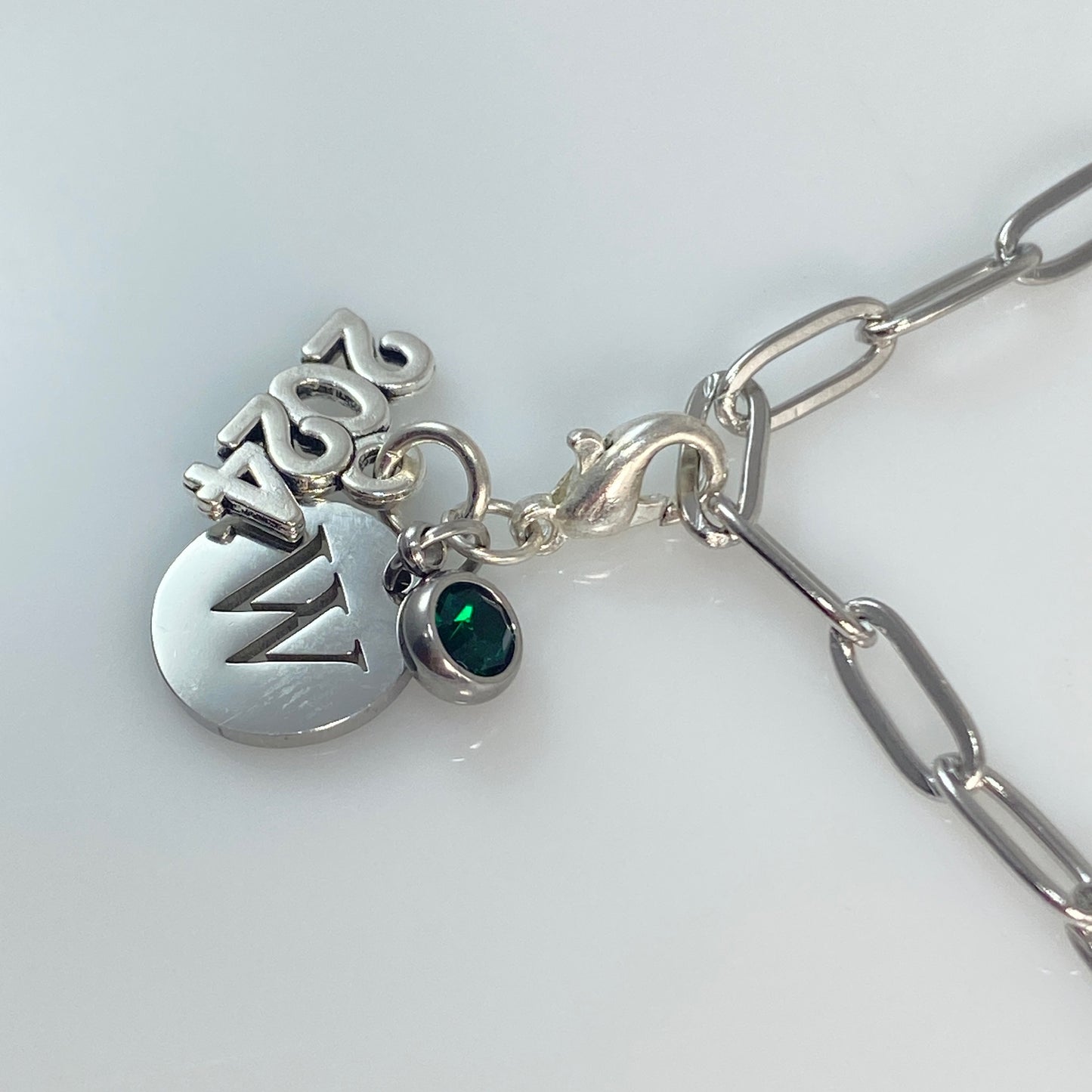 Charm dangle will be with a round bail, not a lobster clasp for the necklace version