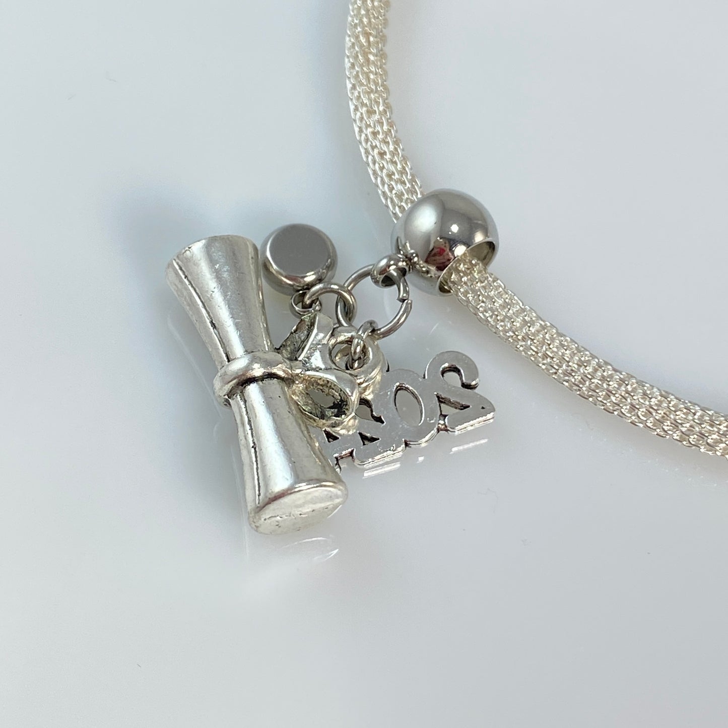 Breloque ou collier ou boucles d'oreilles ou porte-clés de remise de diplôme en argent 2024